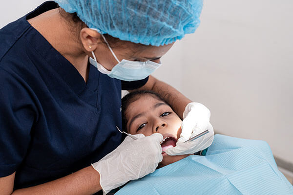 Little girl having a dental treatment