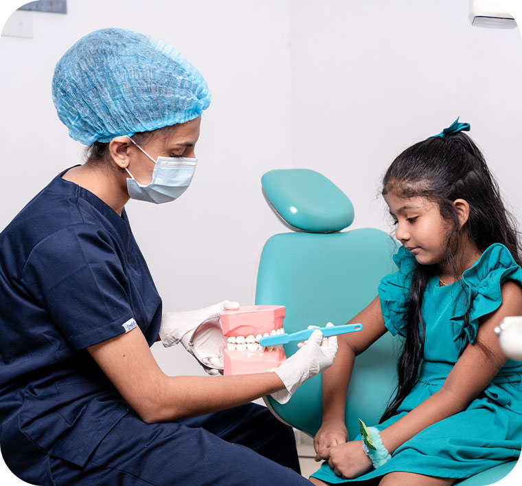 Doctor showing a dental module to kid